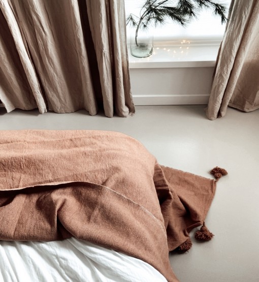 beige camel pompom blanket
